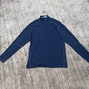 A navy blue Norrona quarter-zip.